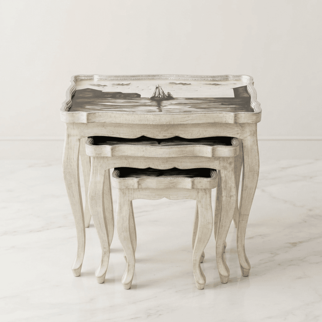 Close-up view of Oceanic Vista Nesting Table's hand-painted sailboat scene