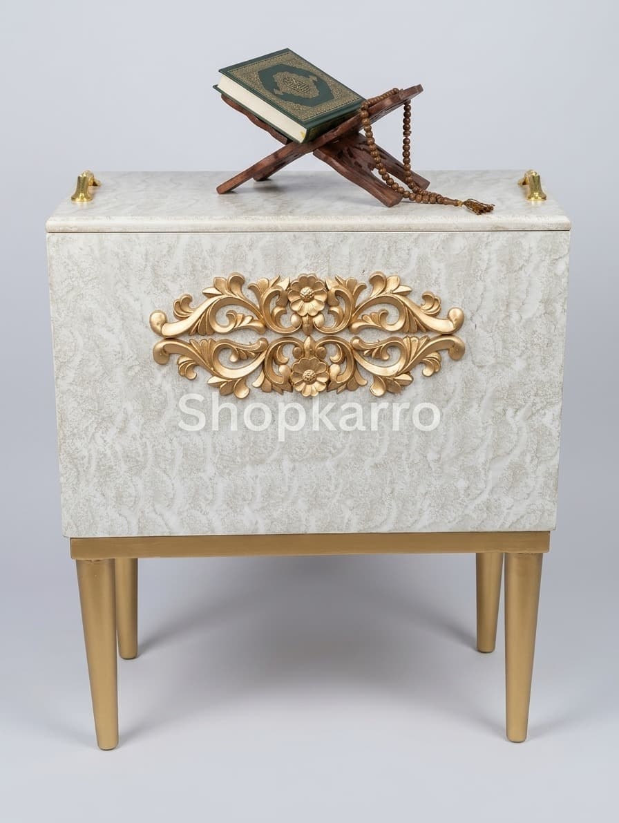  Front view of hand-carved gold floral applique on ivory trunk