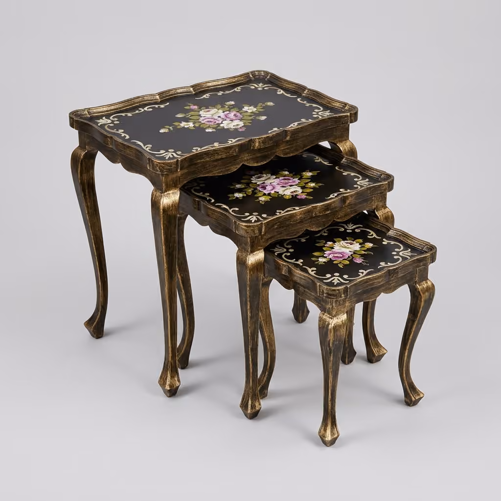 Set of three gold-brushed cabriole leg nesting tables with pink and white floral artwork