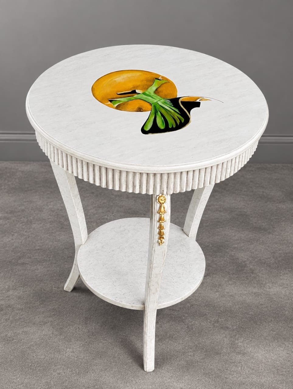 "Premium white side table with brass accents, curved sculptural legs, and hand-painted hummingbird artwork
