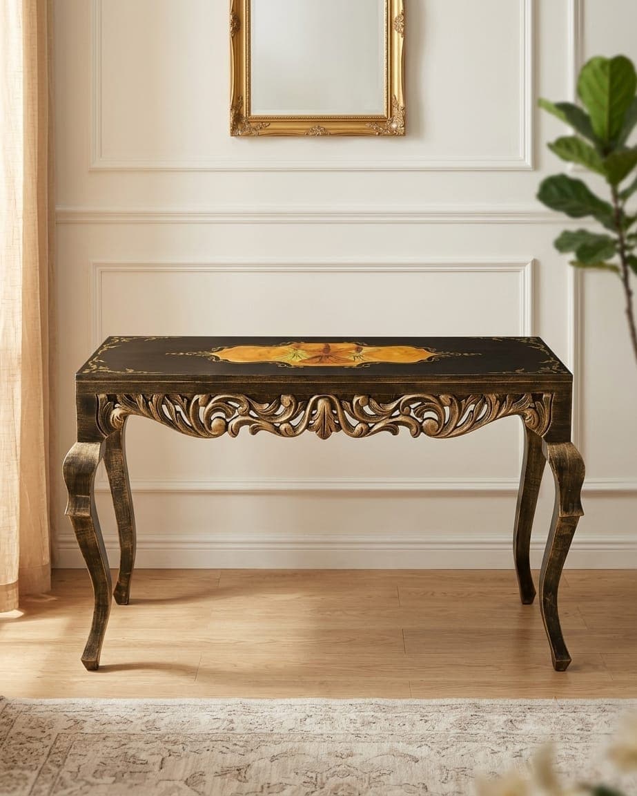 Baroque-style console table featuring intricate gold filigree detailing and baroque carved legs on wooden flooring