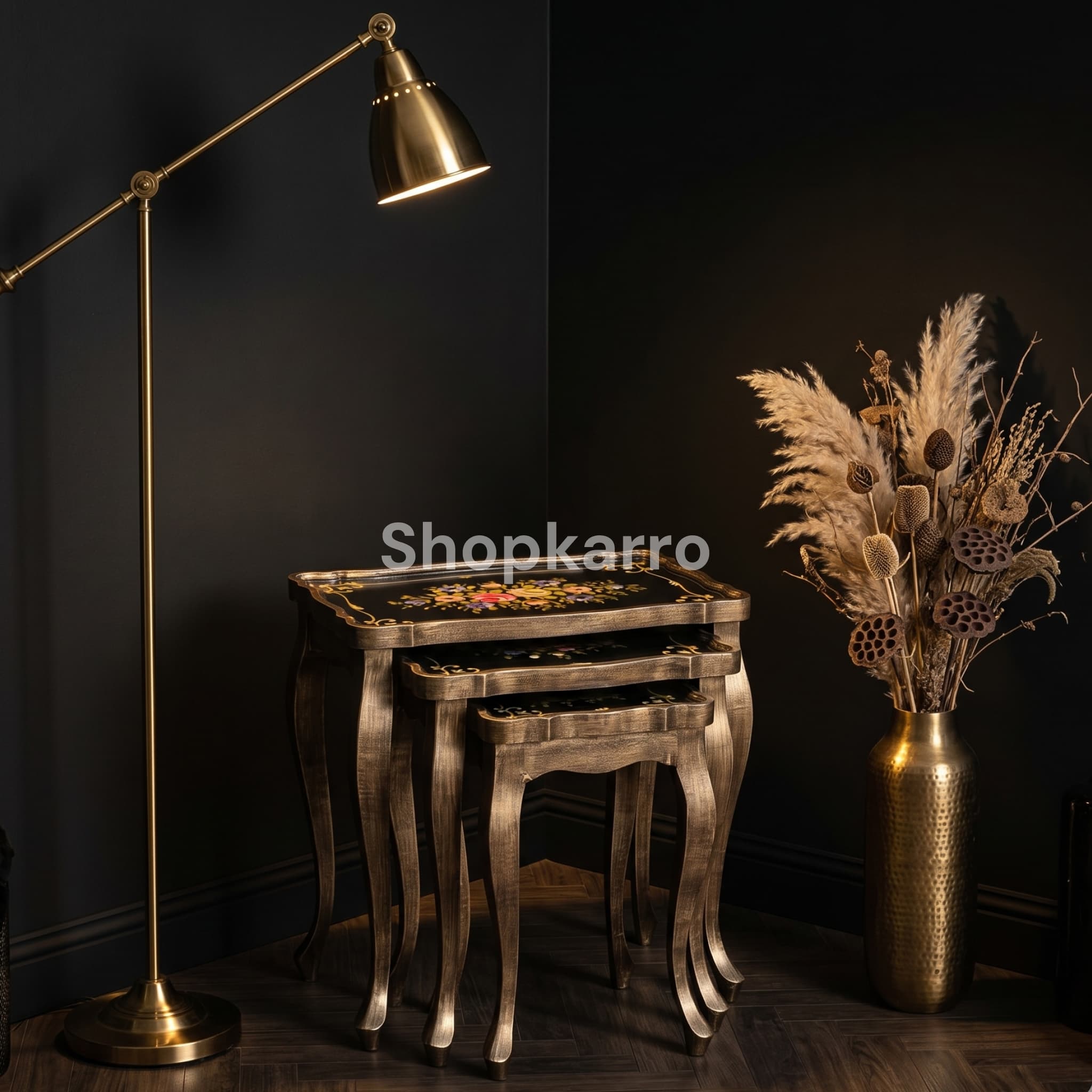Sable Blossom Nesting Tables pulled out in front of dark velvet sofa in luxury Pakistani drawing room