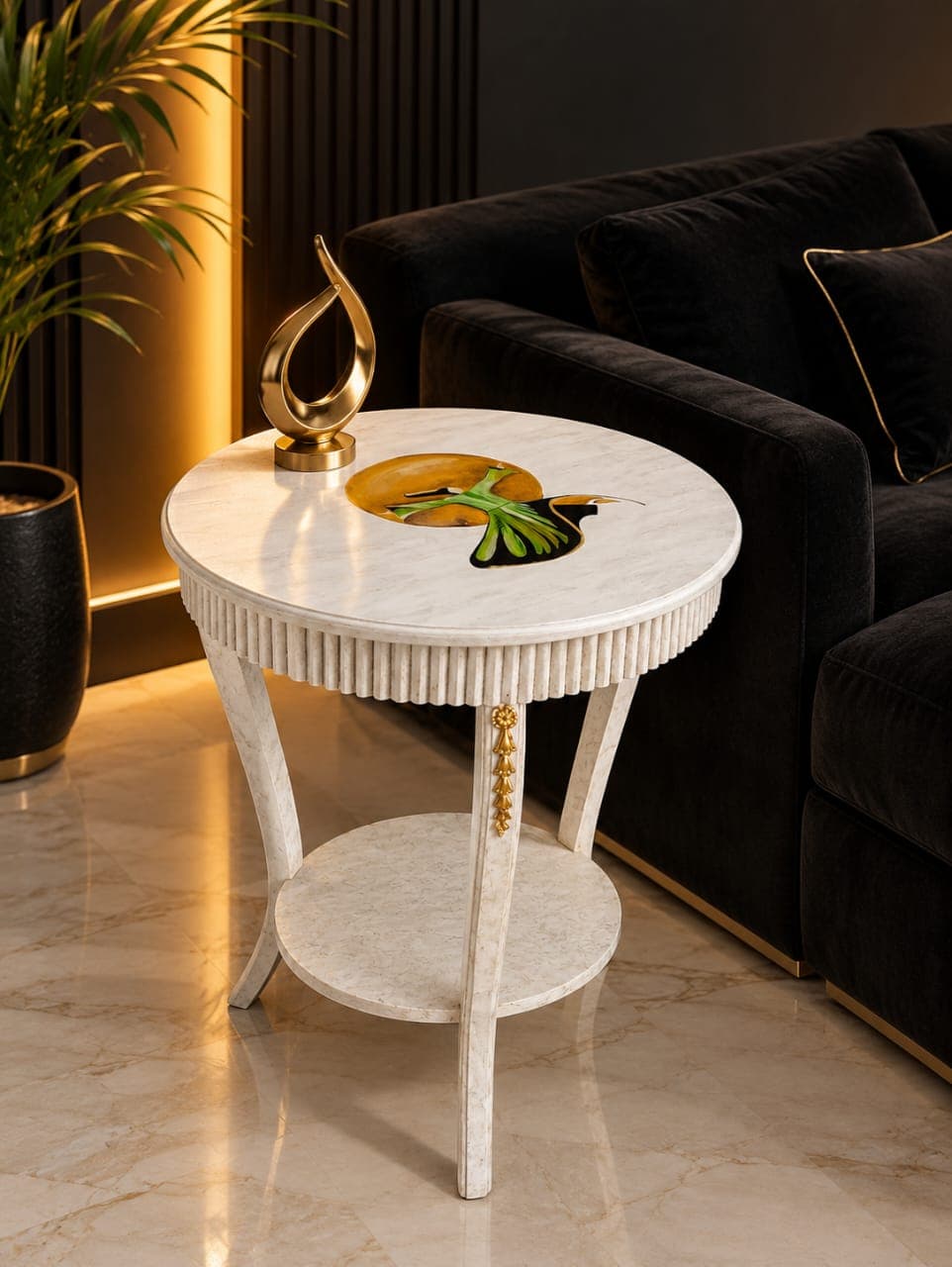 Rumi's Raqs Wooden Table with hand-painted hummingbird design, displayed beside black velvet sofa with golden brass sculpture