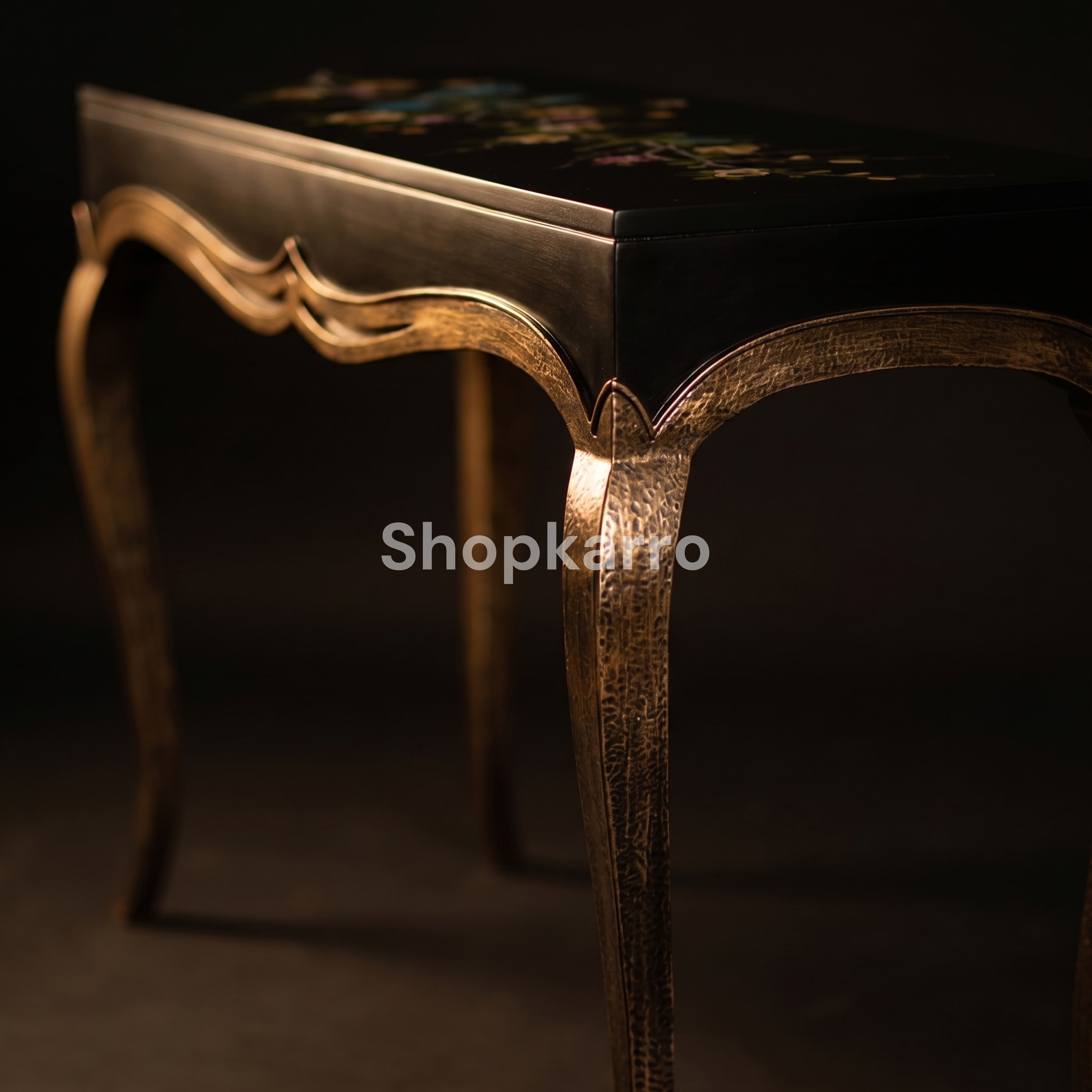 Detailed view of textured metallic bronze cabriole legs and curved frame of Vogue Bloom Console