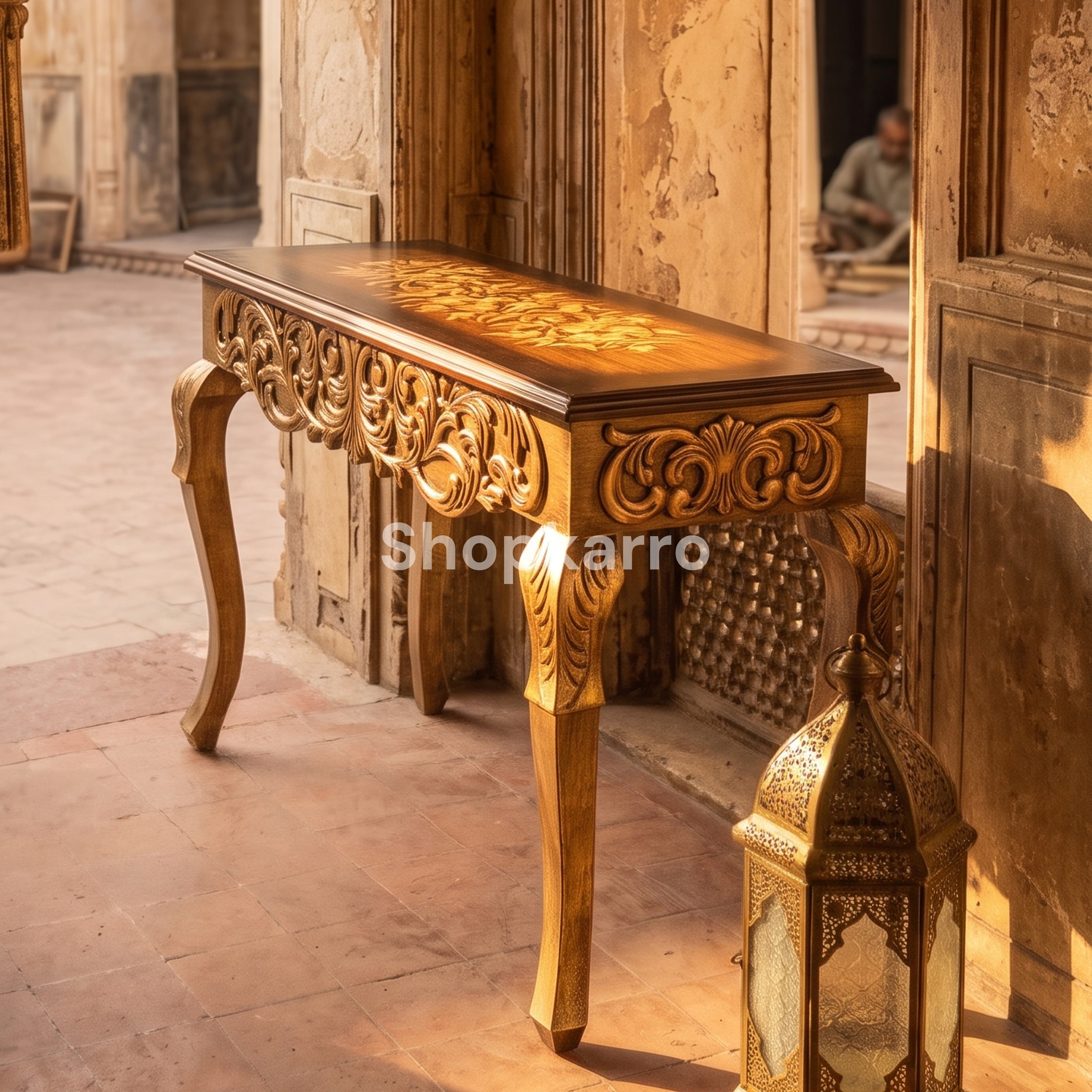 Ornate brown and gold console table in traditional Pakistani haveli courtyard